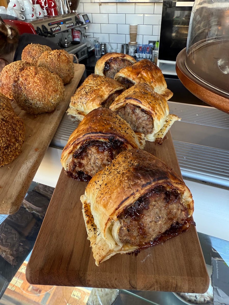 Freshly baked sausage rolls on the Café 118 counter