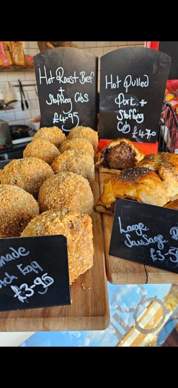 Scotch eggs and sausage rolls on the café counter