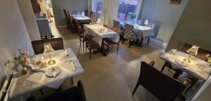 The Café 118 dining room prepared for an evening event
