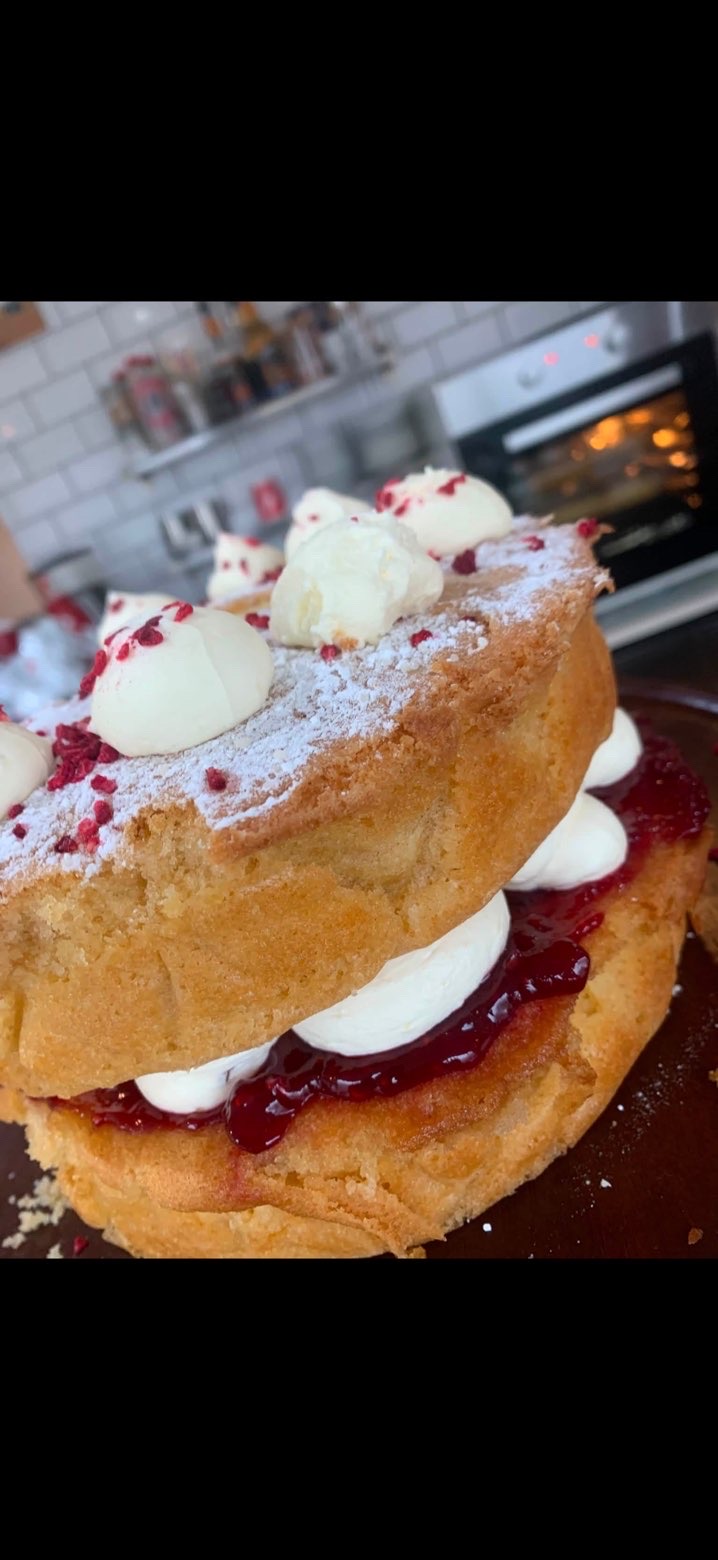 Homemade Victoria sponge cake with cream and berries
